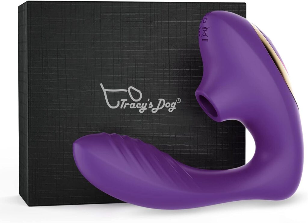 Purple clitoral sucking vibrator. Photographed in front of a black presentation box.