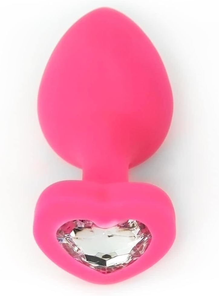 pink silicone butt plug with a clear jewel against a white background